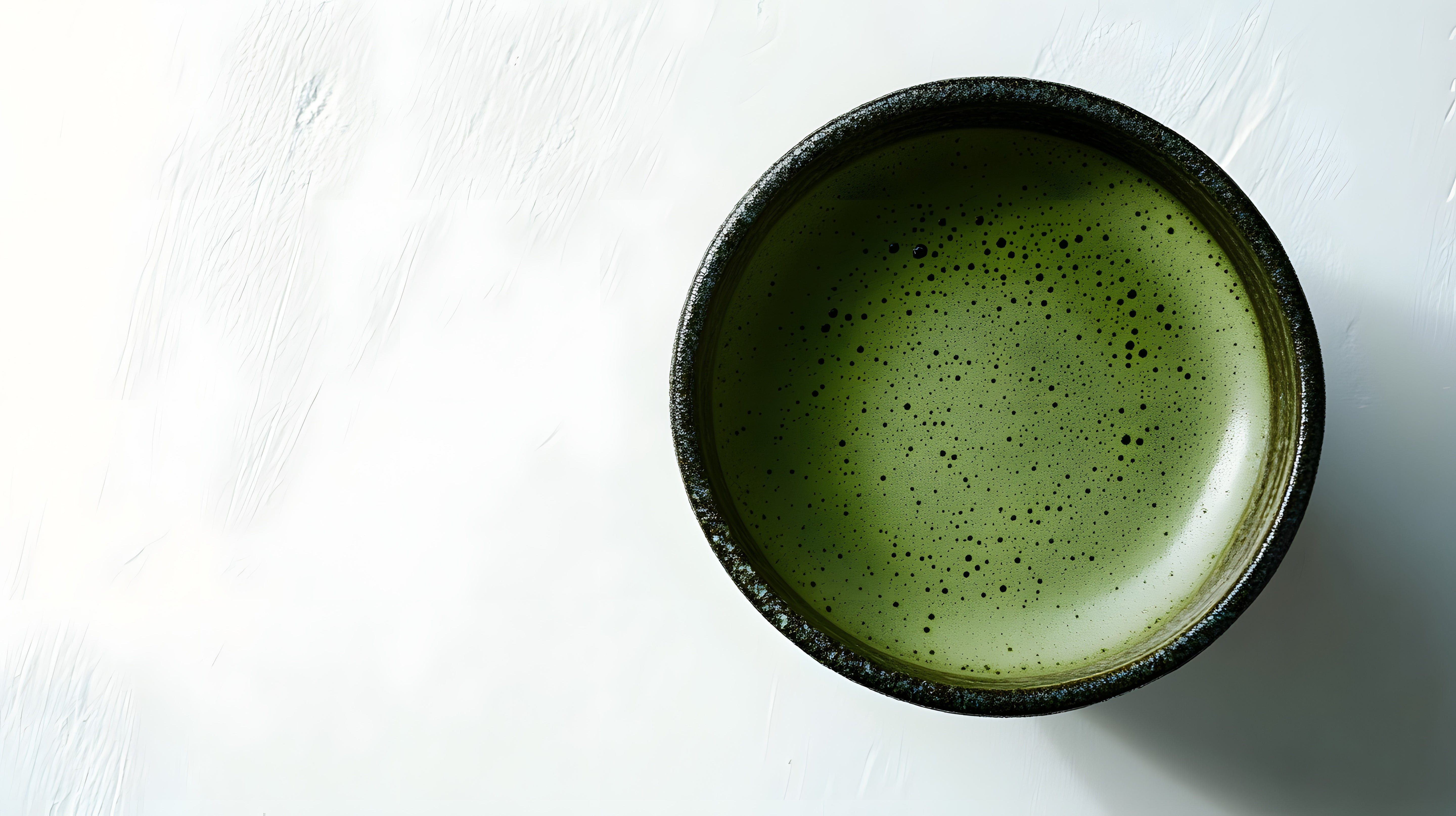 Close-up of Wellcha Matcha, highlighting its smooth texture and rich green color.